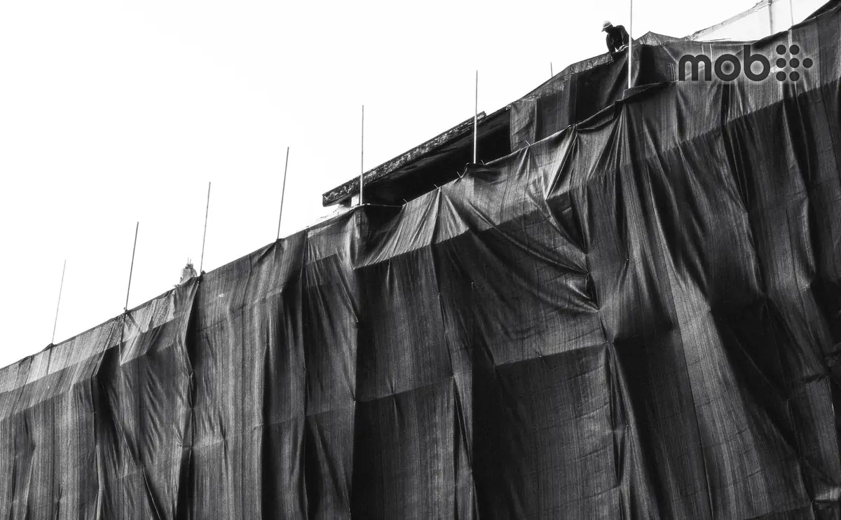 Stack of 19mm plywood sheets ready for use at a construction site in Bangalore