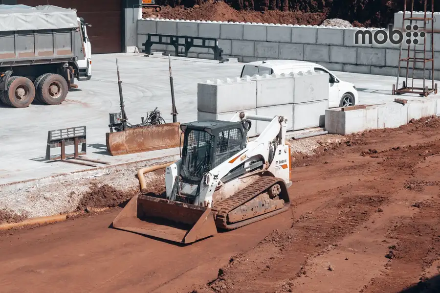 Contractor checking a construction material delivery app on a site