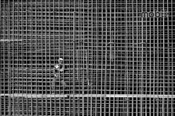 Engineer comparing Fe 500 Fe 500D and Fe 550D TMT reinforcement bars before site delivery